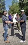 UCWGA members carry a petition with 1,000 names to the campus president's office