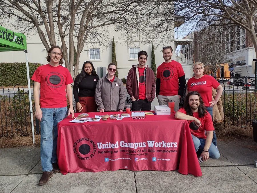 UGA Chapter members table at the 2024 MLK Parade in Athens